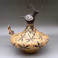 Click for a larger view A polychrome duck pot decorated around the body with a dragonfly and geometric design
by Anderson Jamie Peynetsa of Zuni