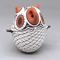 A polychrome owl figure decorated with a bird element design
 by Anderson Jamie Peynetsa of Zuni