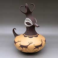 A large polychrome duck pot decorated with a deer with heart line and geometric design
 by Anderson Peynetsa of Zuni