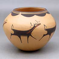 A polychrome jar decorated with a deer-with-heart-line and geometric design
 by Anderson Peynetsa of Zuni