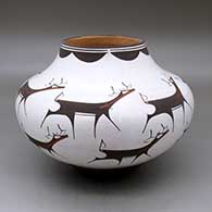 A polychrome jar decorated with a deer-with-heart-line and geometric design
 by Anderson Peynetsa of Zuni