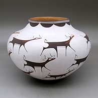 A polychrome jar decorated with a deer-with-heart-line and geometric design
 by Anderson Peynetsa of Zuni