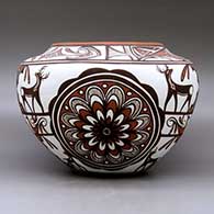 A high shouldered polychrome jar decorated with a two panel rosette, deer with heart line I n his house, rainbird, kiva step, fineline and geometric design. Best of Show and First Place ribbon  from San Diego Museum of Man. First Place ribbon from 2009 Zuni Festival of Arts and Culture, click or tap to see a larger version