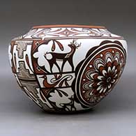 A high shouldered polychrome jar decorated with a two panel rosette, deer with heart line I n his house, rainbird, kiva step, fineline and geometric design. Best of Show and First Place ribbon  from San Diego Museum of Man. First Place ribbon from 2009 Zuni Festival of Arts and Culture, click or tap to see a larger version