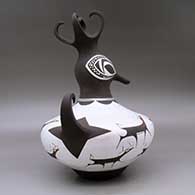 A polychrome duck pot decorated around the body with a deer with heart line and geometric design, click or tap to see a larger version