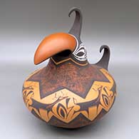 A polychrome parrot pot decorated with a deer with heart line, forest, mountains and geometric design
 by Anderson Peynetsa of Zuni