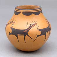 A polychrome jar decorated with a deer with heart line and geometric design
 by Anderson Peynetsa of Zuni