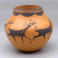 A polychrome jar decorated with a deer with heart line and geometric design
 by Anderson Peynetsa of Zuni