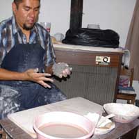 The clay gets worked to remove air bubbles