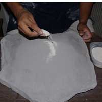 Ground pottery shards are then added to the clay powder